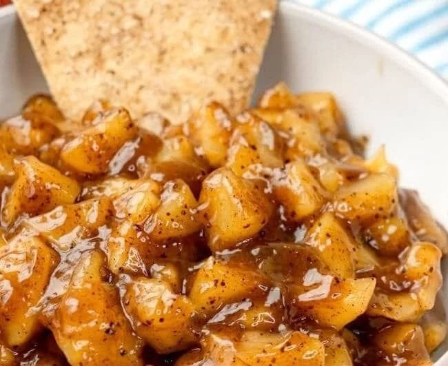 Delicious apple pie dip with cinnamon sugar chips for a tasty dessert.