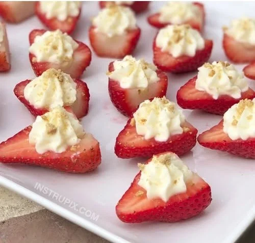 Colorful strawberry party snacks displayed on a festive table