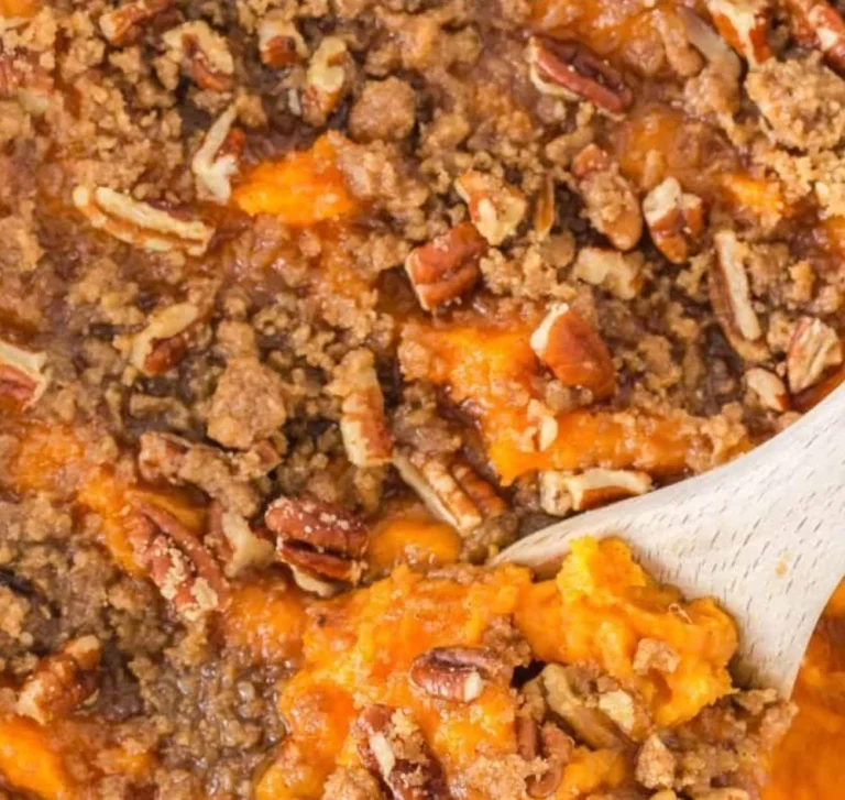 Delicious sweet potato casserole topped with marshmallows and pecans
