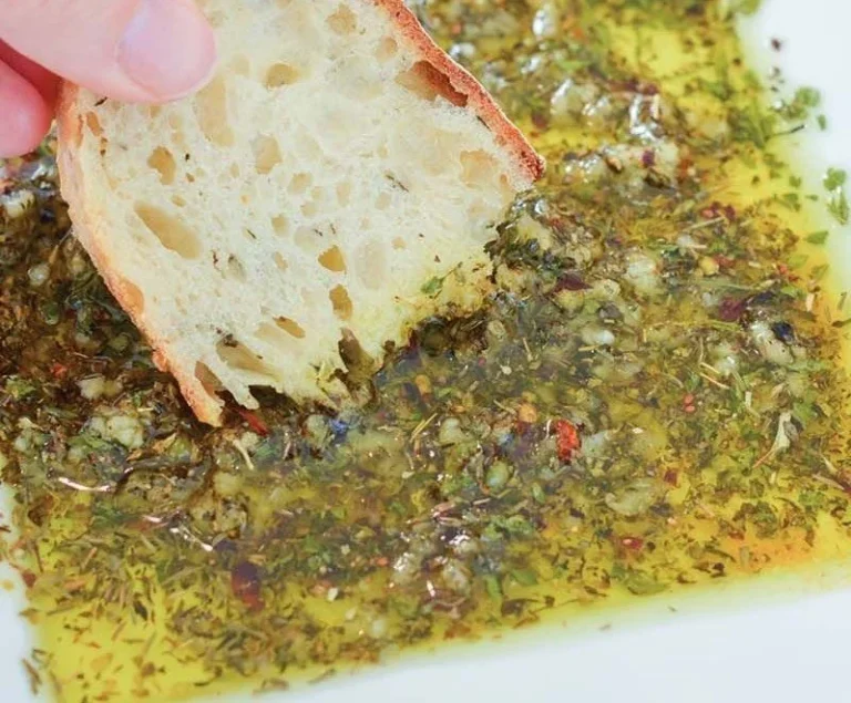 Homemade dipping oil for bread with herbs and spices