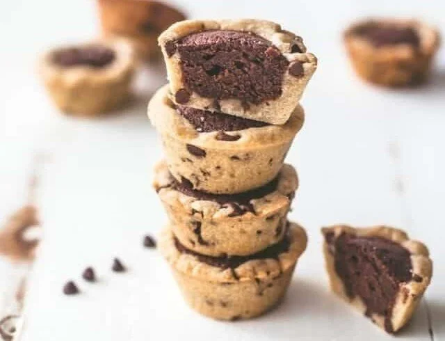 Delicious chocolate brownie tarts served on a white plate