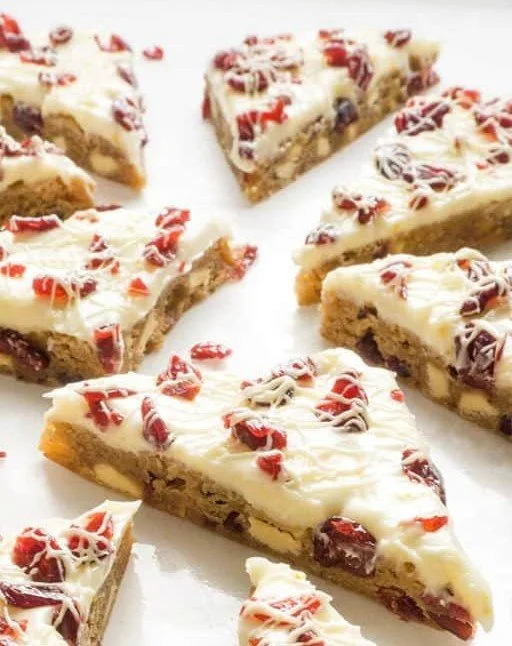 Delicious homemade Cranberry Bliss Bars topped with cream cheese frosting.
