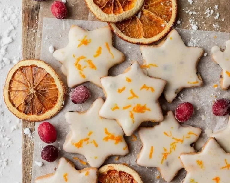 Cranberry-Orange Shortbread Cookies arranged on a festive plate.