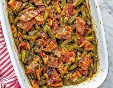 Plate of delicious crack green beans topped with seasonings