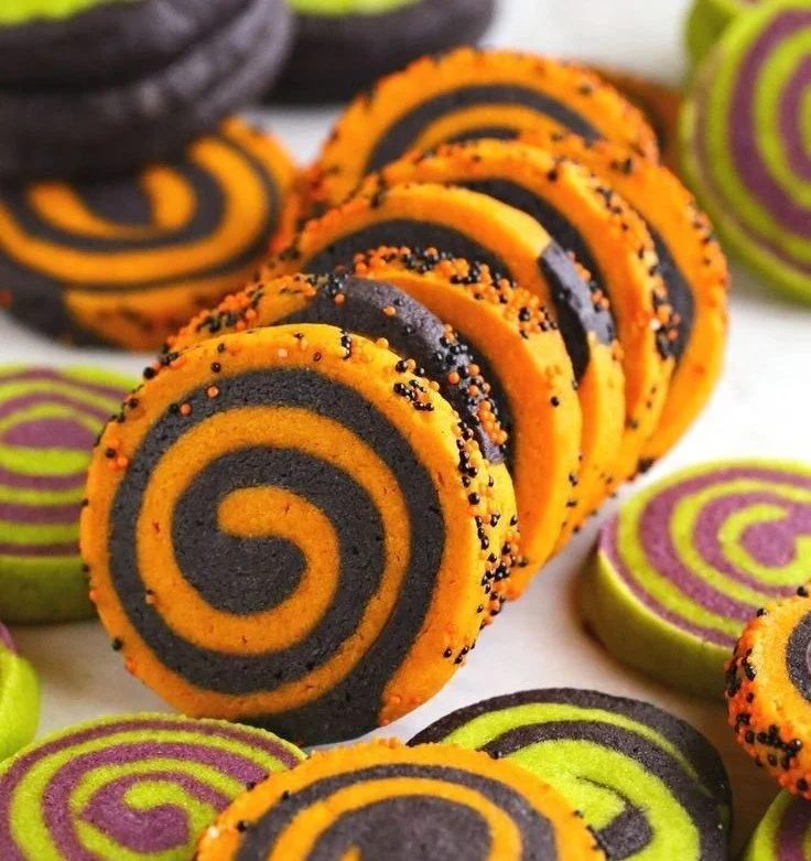 Halloween Pinwheel Sugar Cookies with colorful swirls and festive decorations