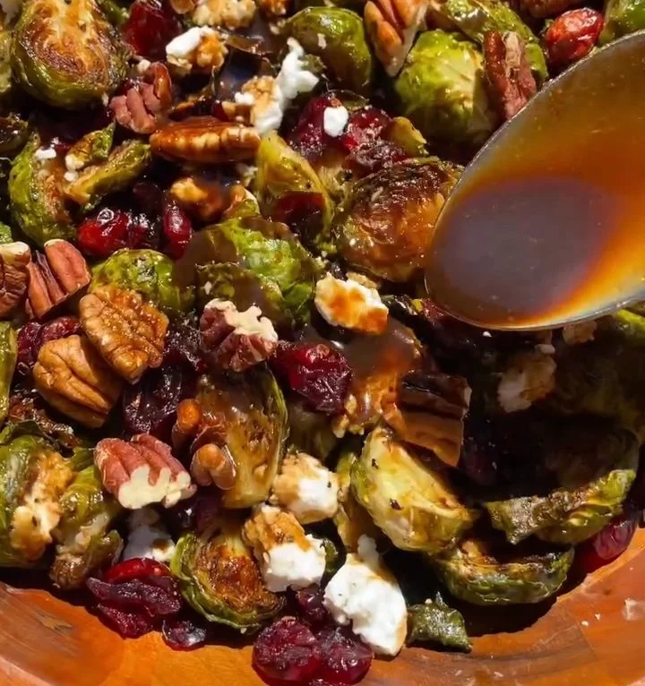 Maple Balsamic Roasted Brussels Sprouts served in a dish for Thanksgiving dinner.