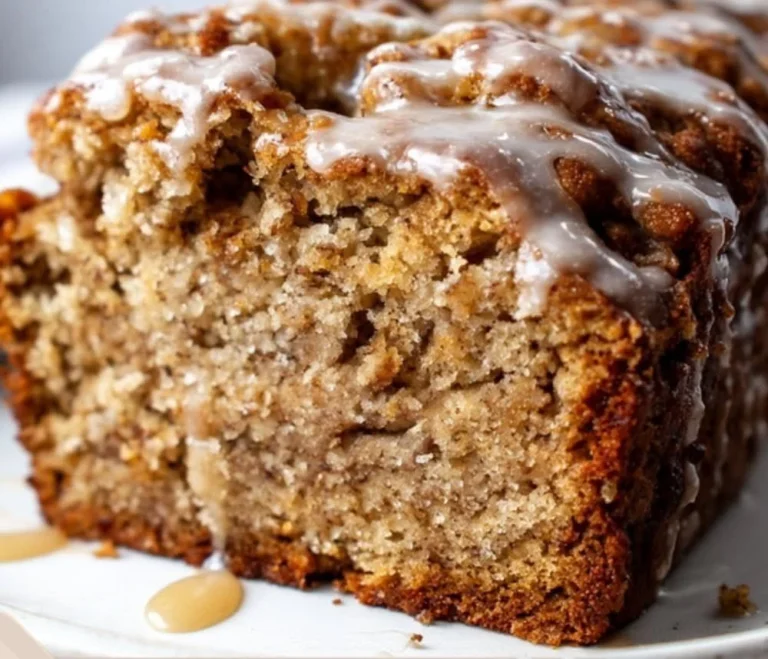 Loaf of moist pumpkin banana bread with nuts and spices