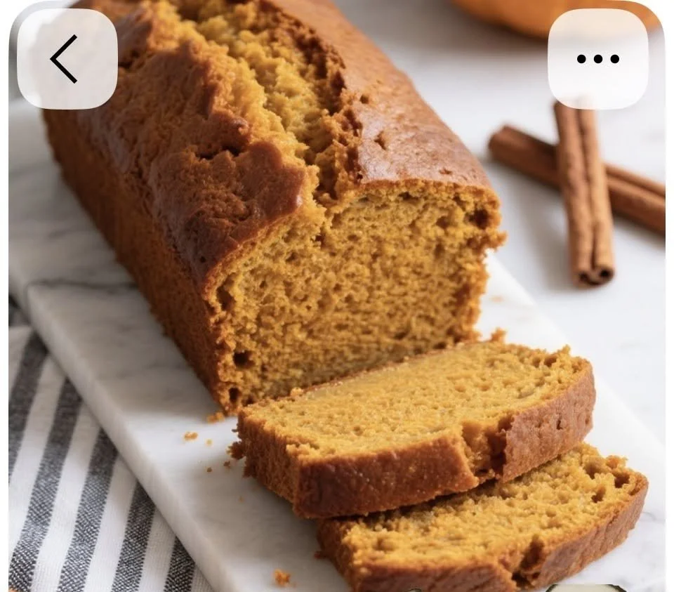 Slice of nut-free pumpkin bread on a plate with autumn decor