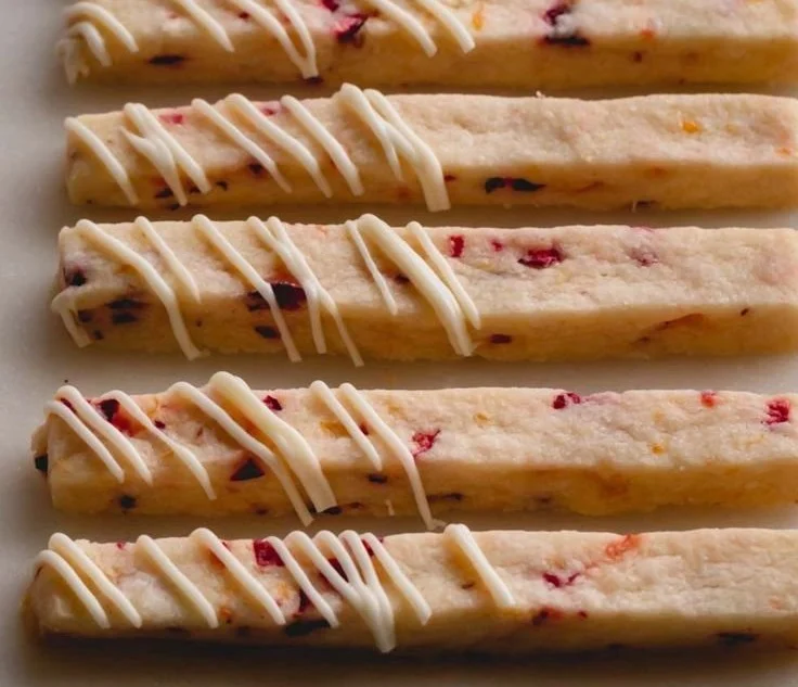Delicious orange cranberry shortbread cookies on a decorative plate
