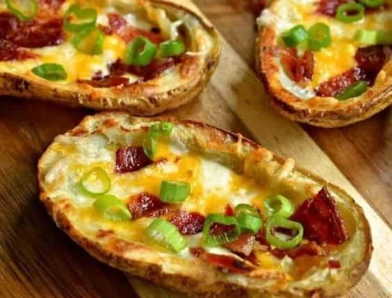Delicious potato skins topped with bacon and green onions