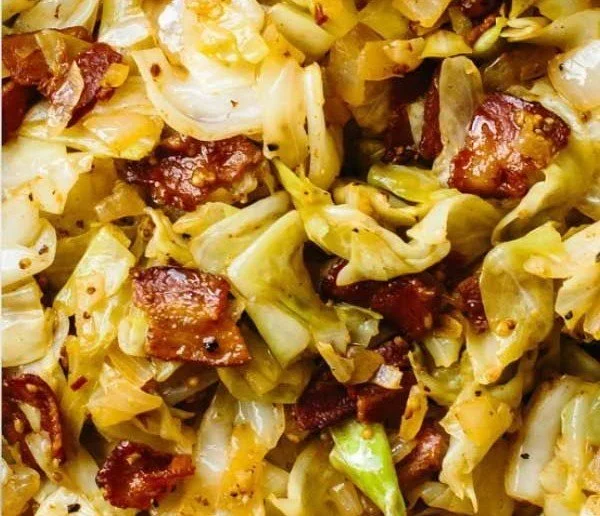 Delicious Southern Fried Cabbage served in a skillet with seasonings